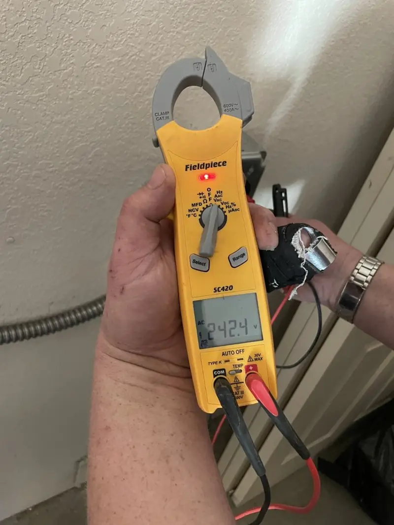 Voltage testing with clamp meter during Recessed Lighting Installation in Grove City